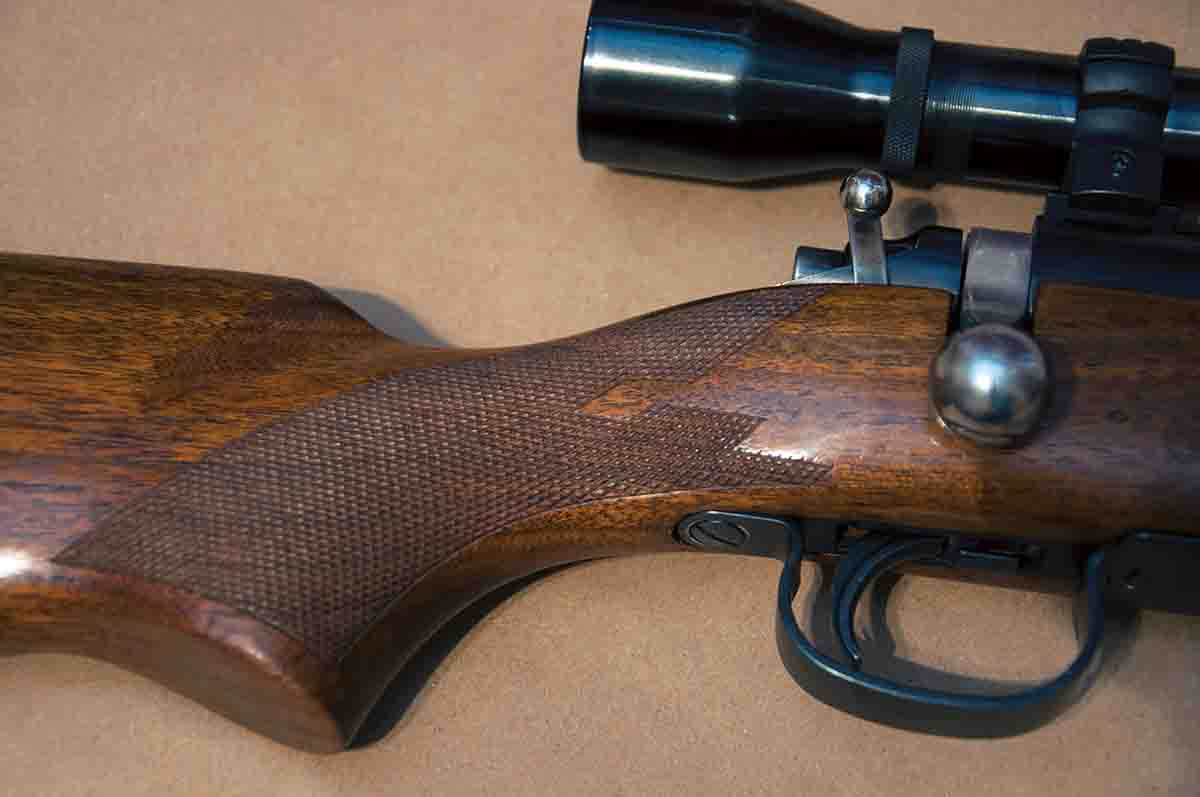 Model 721/722 rifles were eventually offered in different grades that included factory checkering. The nice checkering on this .222 Remington was most likely the work of a previous owner, as was the extended and customized safety lever.